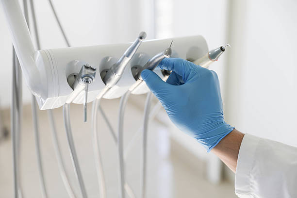 Professional Tooth Extraction technician working in Clinton County County, MI